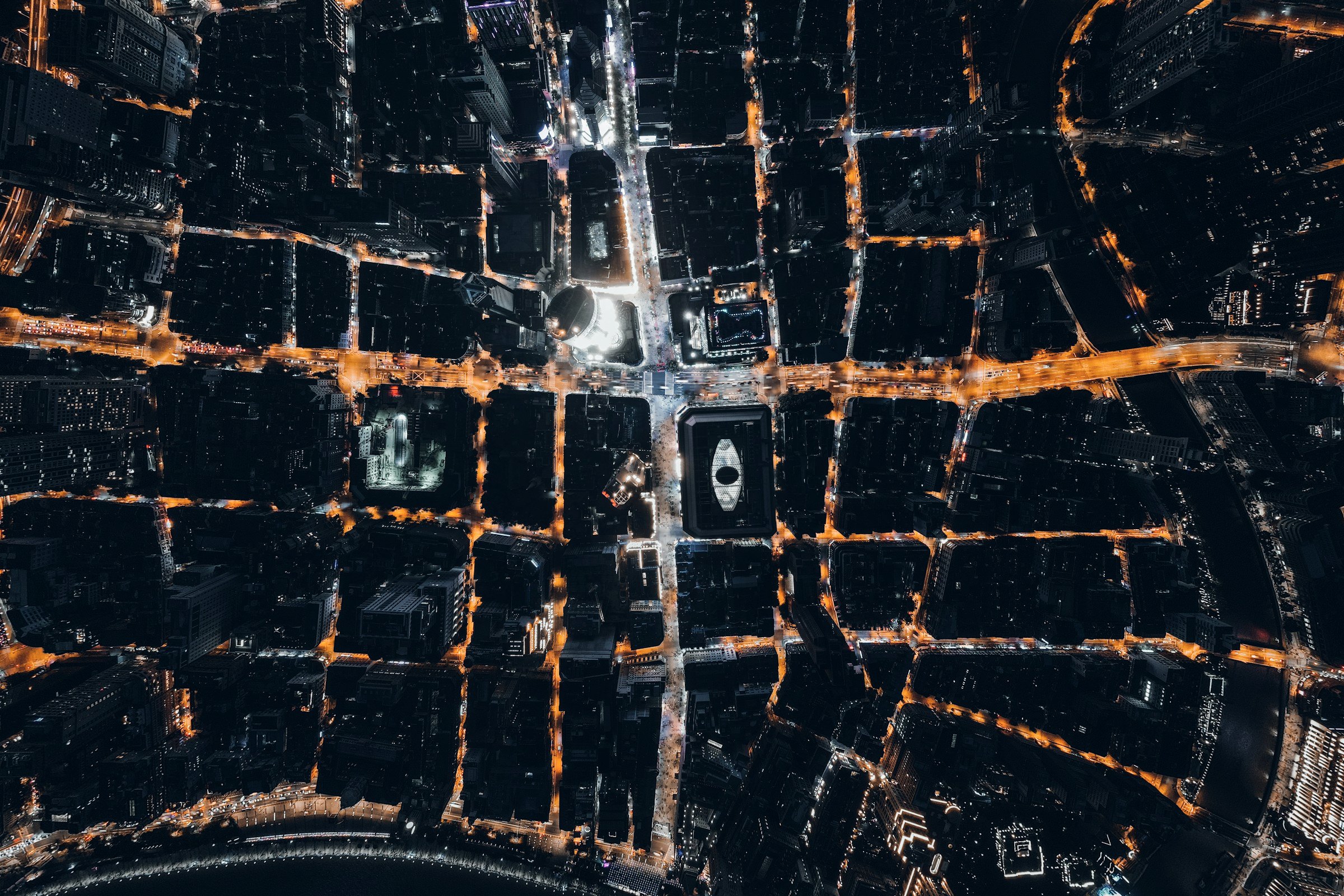 Street grid lit at night, seen from directly above