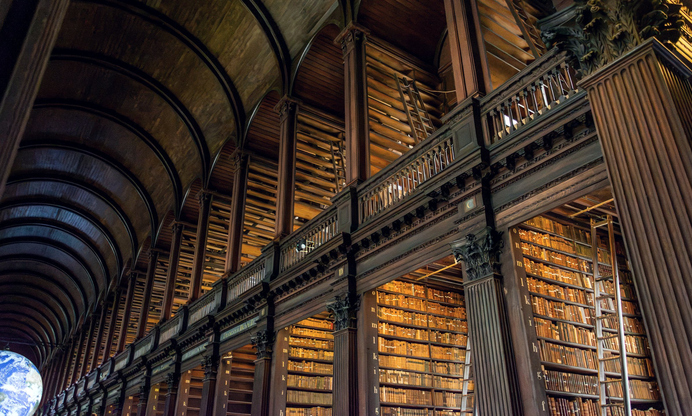 Library with tall wooden bookshelves